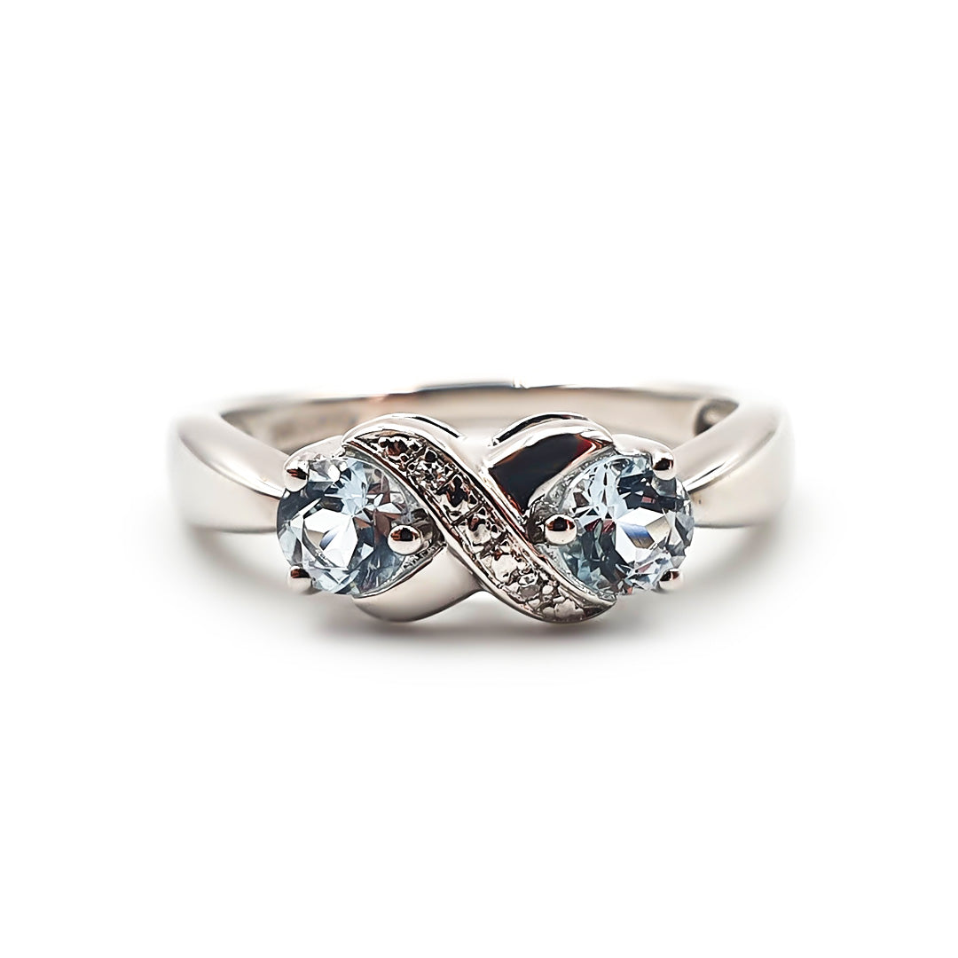 Sterling Silver Ladies Blue Topaz Infinity Ring